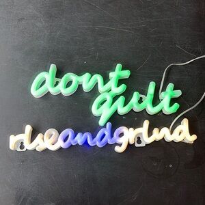 Green and White Neon Signs